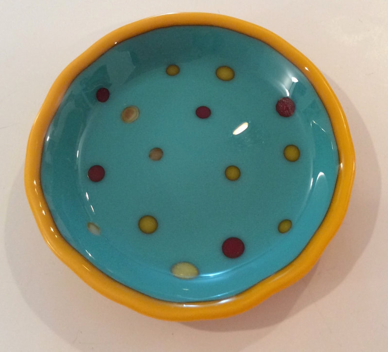fused glass bowl with glass reaction