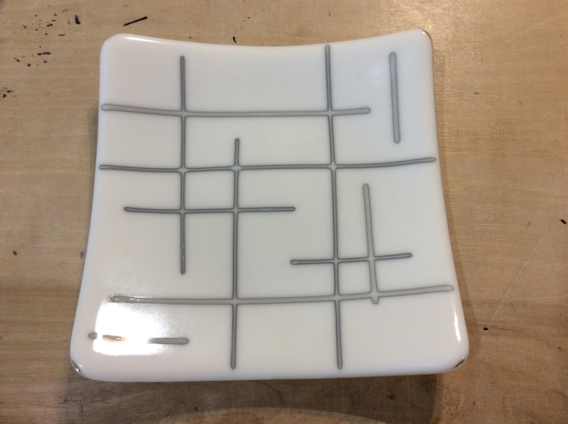 fused glass reaction plate of dense white and french vanilla