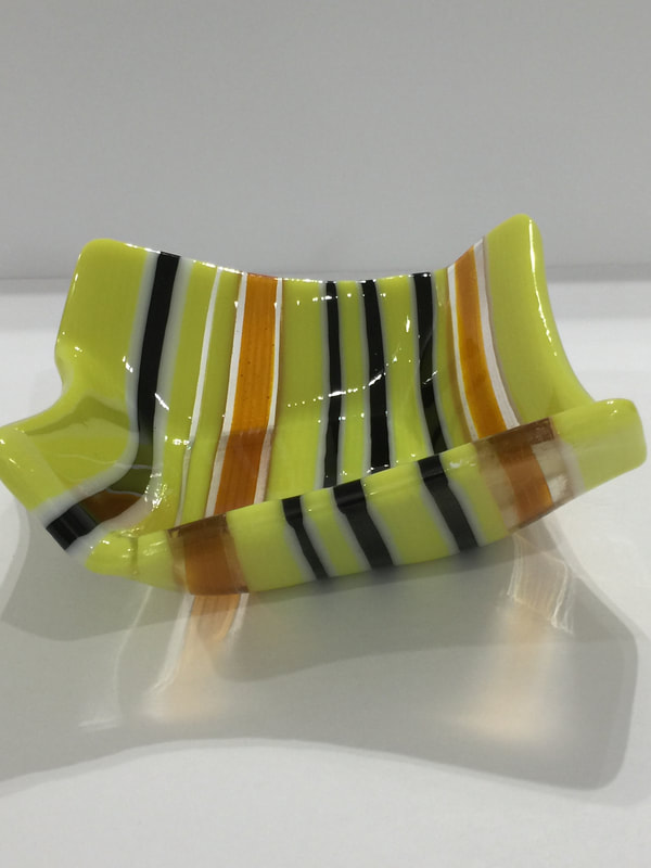 fused glass strips in an origami shaped bowl